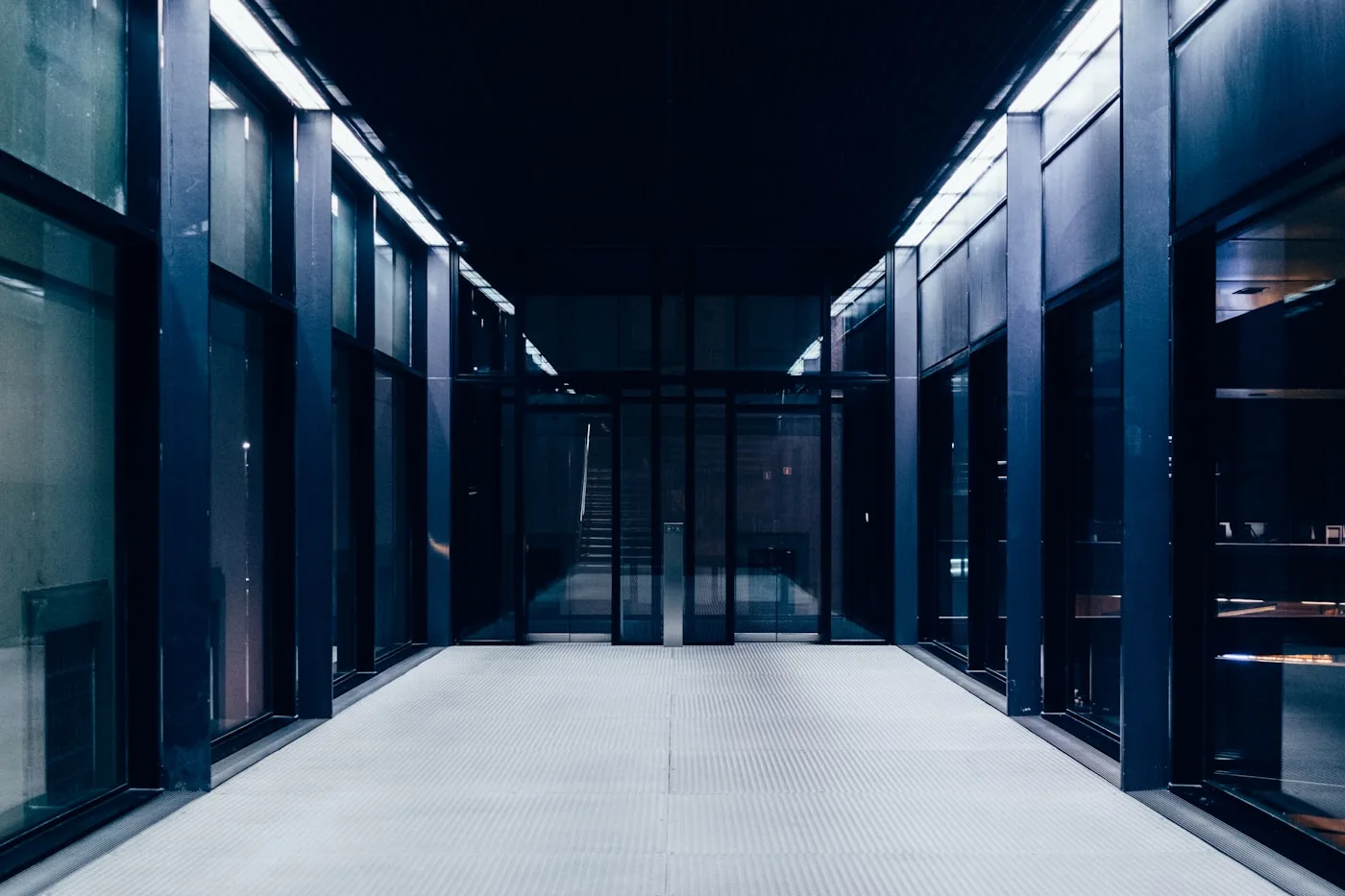 A secured aisle between data center equipment enclosures
